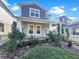 Two-story house with gray siding, white trim, and landscaped front yard at 632 Bayern Ln, Debary, FL 32713