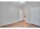 Well-lit bedroom featuring wood flooring and a double door closet at 9032 Oak Moss Dr, Orlando, FL 32832