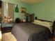 Cozy bedroom with a full-size bed and window coverings at 110 Cypress Woods Ct # 5C, Deltona, FL 32725