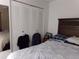 Spacious bedroom with large closet and king-size bed at 110 Cypress Woods Ct # 5C, Deltona, FL 32725