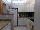 Updated kitchen featuring white cabinets and granite counters at 110 Cypress Woods Ct # 5C, Deltona, FL 32725