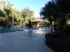 Community pool with ample seating and shade at 110 Cypress Woods Ct # 5C, Deltona, FL 32725