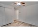 Bright bedroom with wood-look floors and double closet at 12755 Oulton Cir, Orlando, FL 32832