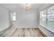 Bright dining room with hardwood floors and chandelier at 12755 Oulton Cir, Orlando, FL 32832