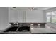 Kitchen with granite countertop and double sink at 12755 Oulton Cir, Orlando, FL 32832