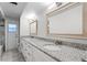Double vanity bathroom with granite countertops and updated fixtures at 203 Red Bud Ln, Longwood, FL 32779