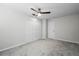 Bright bedroom with ceiling fan, carpet, and ample closet space at 203 Red Bud Ln, Longwood, FL 32779
