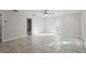 Main bedroom with tile floor, ceiling fan, and access to private patio at 203 Red Bud Ln, Longwood, FL 32779