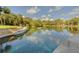 Resort-style pool with lounge chairs in a lush green community setting at 203 Red Bud Ln, Longwood, FL 32779