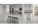 Modern kitchen with white cabinets, granite countertops, and a breakfast bar at 203 Red Bud Ln, Longwood, FL 32779