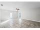 Open living area with tile floors and access to backyard patio at 203 Red Bud Ln, Longwood, FL 32779