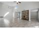 Spacious living room featuring a large stone fireplace and high ceilings at 203 Red Bud Ln, Longwood, FL 32779