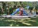 playground with slides and climbing structures at 203 Red Bud Ln, Longwood, FL 32779