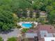 Refreshing community swimming pool with surrounding green space at 203 Red Bud Ln, Longwood, FL 32779