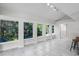 Bright sunroom with large windows offering abundant natural light at 203 Red Bud Ln, Longwood, FL 32779