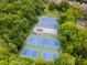 Well-maintained tennis and pickleball courts nestled within a community at 203 Red Bud Ln, Longwood, FL 32779