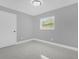 Bright bedroom with window and neutral color scheme at 2316 Douglas Thomas Ct, Orlando, FL 32807