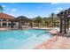 Community pool with pergola and brick patio at 286 Marcello Blvd, Kissimmee, FL 34746