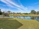Backyard with pond view and fenced-in area at 3149 Bear Path, Kissimmee, FL 34746