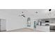 Open concept living room and kitchen with vaulted ceilings at 3149 Bear Path, Kissimmee, FL 34746