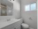 Clean bathroom with white vanity, toilet, and shower with tile surround at 36 Marigold Ln, Debary, FL 32713