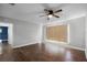 Spacious bedroom with wood flooring and ceiling fan at 36 Marigold Ln, Debary, FL 32713