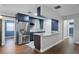 Modern kitchen featuring stainless steel appliances and blue cabinetry at 36 Marigold Ln, Debary, FL 32713