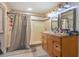 Bathroom with double vanity, shower, and updated finishes at 402 Satsuma Dr, Sanford, FL 32771