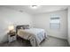Simple bedroom with a double bed and nightstand at 4932 Mainsail St, Haines City, FL 33844