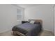 Bright bedroom with striped bedding and wood nightstand at 4932 Mainsail St, Haines City, FL 33844