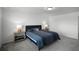 Main bedroom with king bed and en-suite bathroom access at 4932 Mainsail St, Haines City, FL 33844