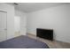 Guest bedroom with dresser and striped bedding at 4932 Mainsail St, Haines City, FL 33844