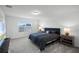 Main bedroom with king-size bed and ensuite bathroom at 4932 Mainsail St, Haines City, FL 33844