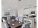 Open concept dining area with kitchen island and table at 4932 Mainsail St, Haines City, FL 33844