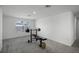 Bright home gym with weight bench, barbell, and pull-up bar at 4932 Mainsail St, Haines City, FL 33844