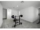 Spacious home gym with weight bench and pull-up bar at 4932 Mainsail St, Haines City, FL 33844