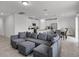 Open concept living area with sectional sofa and kitchen at 4932 Mainsail St, Haines City, FL 33844