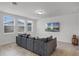 Living room with gray sectional sofa and large TV at 4932 Mainsail St, Haines City, FL 33844