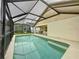 Screened-in pool with access from covered patio at 531 Hollingshead Loop, Davenport, FL 33896