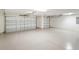 Two-car garage with epoxy coated flooring and ample space at 5810 Penney Ln, The Villages, FL 32163