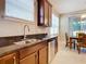 Kitchen sink and dishwasher with granite countertop at 688 Preakness Cir, Deland, FL 32724