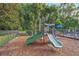 Community playground with slides and climbing structures at 688 Preakness Cir, Deland, FL 32724