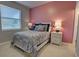 Cozy bedroom with a queen-size bed, nightstands, and a tranquil color palette at 9997 Oak Quarry Dr, Orlando, FL 32832