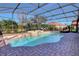 Inviting freeform pool with a covered patio and fountain feature at 9997 Oak Quarry Dr, Orlando, FL 32832