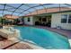 Relaxing screened pool and spa with brick deck at 9997 Oak Quarry Dr, Orlando, FL 32832