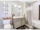 Clean bathroom with a bathtub, vanity, and shower at 16300 County Road 455 # 610, Montverde, FL 34756