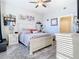 Spacious bedroom with light flooring and a comfortable-looking bed at 16300 County Road 455 # 610, Montverde, FL 34756