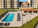 Community pool with plenty of lounge chairs at 16300 County Road 455 # 610, Montverde, FL 34756