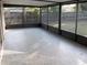 Spacious screened porch with pebble-textured floor at 2432 E Locke Ave, Orlando, FL 32818