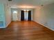 Large living room featuring hardwood floors and lots of natural light at 319 E Jersey St, Orlando, FL 32806